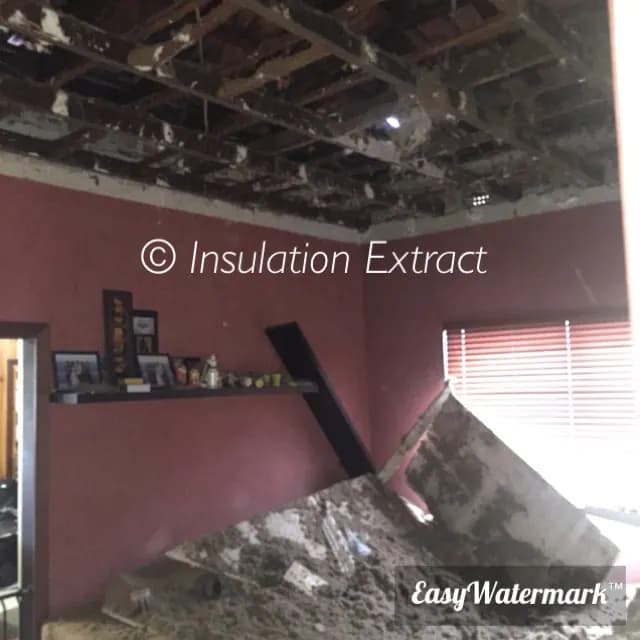 Room with a collapsed ceiling and fallen old insulation